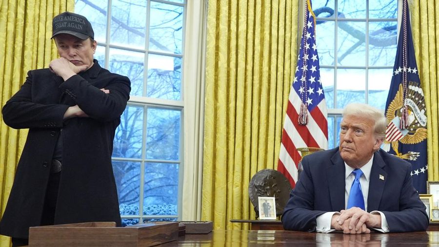 Elon Musk listens as President Donald Trump speaks with reporters in the Oval Office at the White House, Tuesday, Feb. 11, 2025, in Washington. (Photo/Alex Brandon)