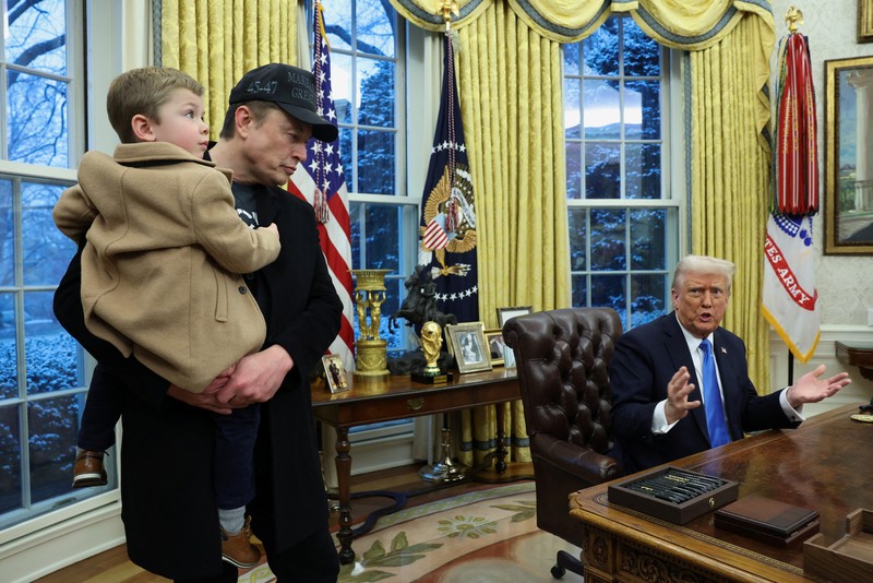 A combination picture shows Elon Musk speaking as he carries his son,  X Æ A-12 on his shoulders, next to U.S. President Donald Trump (not pictured) in the Oval Office of the White House in Washington, D.C., U.S., February 11, 2025.   REUTERS/Kevin Lamarque