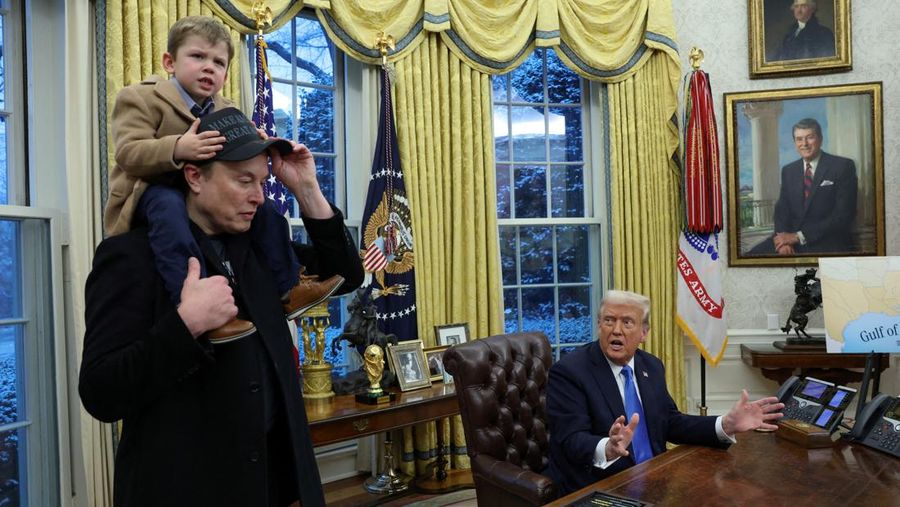 USA-TRUMP/ U.S. President Donald Trump speaks as Elon Musk carries X Æ A-12 on his shoulders in the Oval Office of the White House in Washington, D.C., U.S., February 11, 2025. REUTERS/Kevin Lamarque TPX IMAGES OF THE DAY