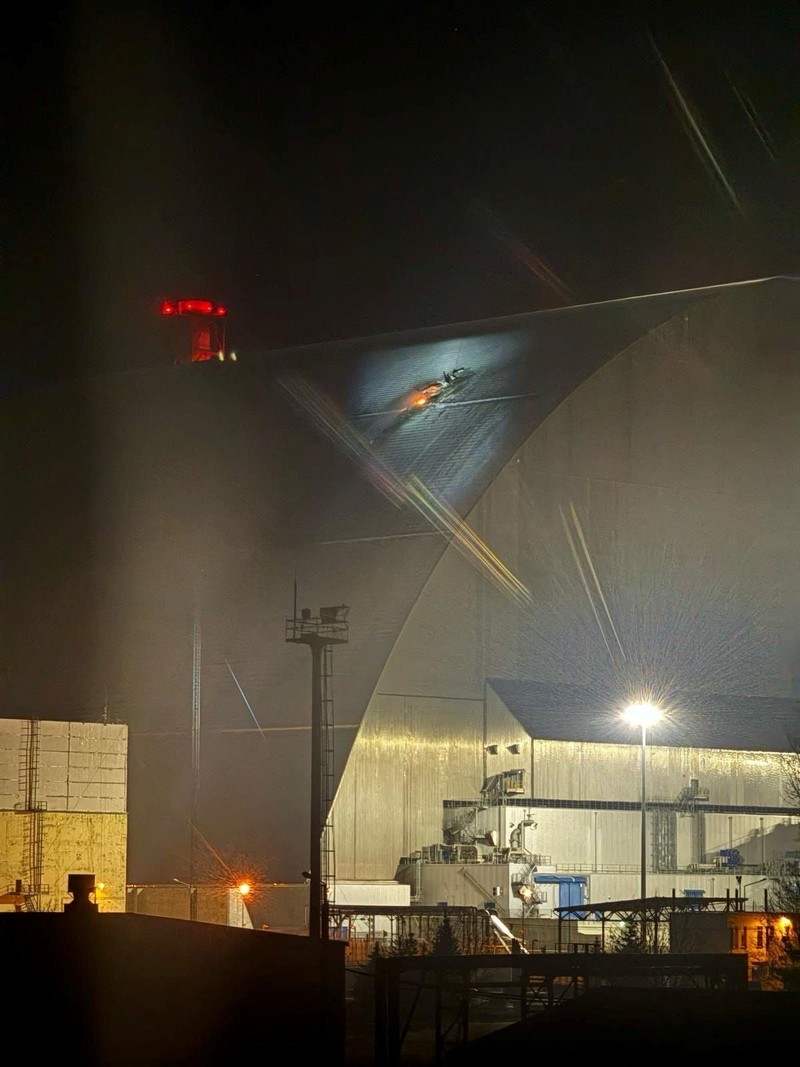 An engine of a Russian kamikaze drone is seen under the New Safe Confinement (NSC) structure, that covers the old sarcophagus which confines the remains of the damaged fourth reactor, after it was hit by what Ukrainian President Volodymyr Zelenskiy said is a Russian drone strike, amid Russia's attack on Ukraine, at the Chornobyl Nuclear Power Plant, in Kyiv region, Ukraine February 14, 2025. Press service of the State Emergency Service of Ukraine/Handout via REUTERS ATTENTION EDITORS - THIS IMAGE HAS BEEN SUPPLIED BY A THIRD PARTY. DO NOT OBSCURE LOGO.