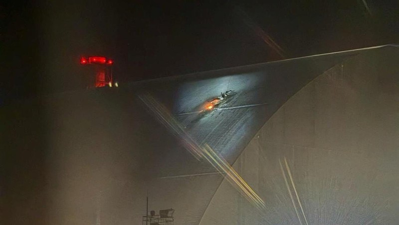 An engine of a Russian kamikaze drone is seen under the New Safe Confinement (NSC) structure, that covers the old sarcophagus which confines the remains of the damaged fourth reactor, after it was hit by what Ukrainian President Volodymyr Zelenskiy said is a Russian drone strike, amid Russia's attack on Ukraine, at the Chornobyl Nuclear Power Plant, in Kyiv region, Ukraine February 14, 2025. Press service of the State Emergency Service of Ukraine/Handout via REUTERS ATTENTION EDITORS - THIS IMAGE HAS BEEN SUPPLIED BY A THIRD PARTY. DO NOT OBSCURE LOGO.