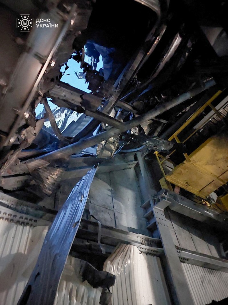 An engine of a Russian kamikaze drone is seen under the New Safe Confinement (NSC) structure, that covers the old sarcophagus which confines the remains of the damaged fourth reactor, after it was hit by what Ukrainian President Volodymyr Zelenskiy said is a Russian drone strike, amid Russia's attack on Ukraine, at the Chornobyl Nuclear Power Plant, in Kyiv region, Ukraine February 14, 2025. Press service of the State Emergency Service of Ukraine/Handout via REUTERS ATTENTION EDITORS - THIS IMAGE HAS BEEN SUPPLIED BY A THIRD PARTY. DO NOT OBSCURE LOGO.