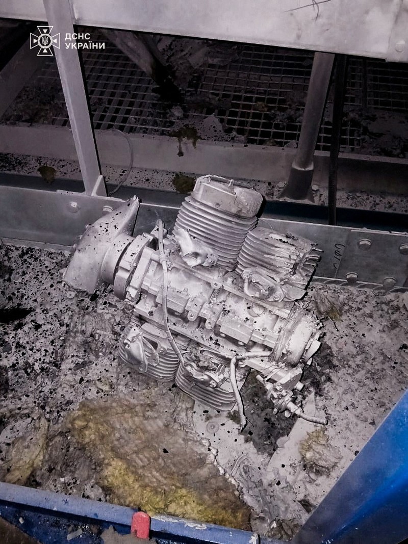 An engine of a Russian kamikaze drone is seen under the New Safe Confinement (NSC) structure, that covers the old sarcophagus which confines the remains of the damaged fourth reactor, after it was hit by what Ukrainian President Volodymyr Zelenskiy said is a Russian drone strike, amid Russia's attack on Ukraine, at the Chornobyl Nuclear Power Plant, in Kyiv region, Ukraine February 14, 2025. Press service of the State Emergency Service of Ukraine/Handout via REUTERS ATTENTION EDITORS - THIS IMAGE HAS BEEN SUPPLIED BY A THIRD PARTY. DO NOT OBSCURE LOGO.