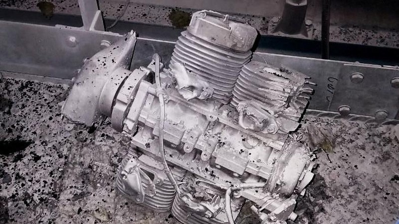 An engine of a Russian kamikaze drone is seen under the New Safe Confinement (NSC) structure, that covers the old sarcophagus which confines the remains of the damaged fourth reactor, after it was hit by what Ukrainian President Volodymyr Zelenskiy said is a Russian drone strike, amid Russia's attack on Ukraine, at the Chornobyl Nuclear Power Plant, in Kyiv region, Ukraine February 14, 2025. Press service of the State Emergency Service of Ukraine/Handout via REUTERS ATTENTION EDITORS - THIS IMAGE HAS BEEN SUPPLIED BY A THIRD PARTY. DO NOT OBSCURE LOGO.