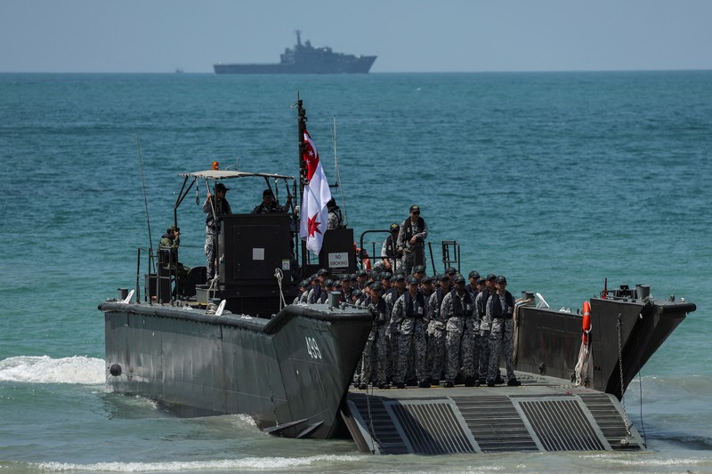 THAILAND-USA/MILITARY DRILL Smoke rises from an amphibious assault vehicles (AAV) participating in an amphibious assault exercise as part of the