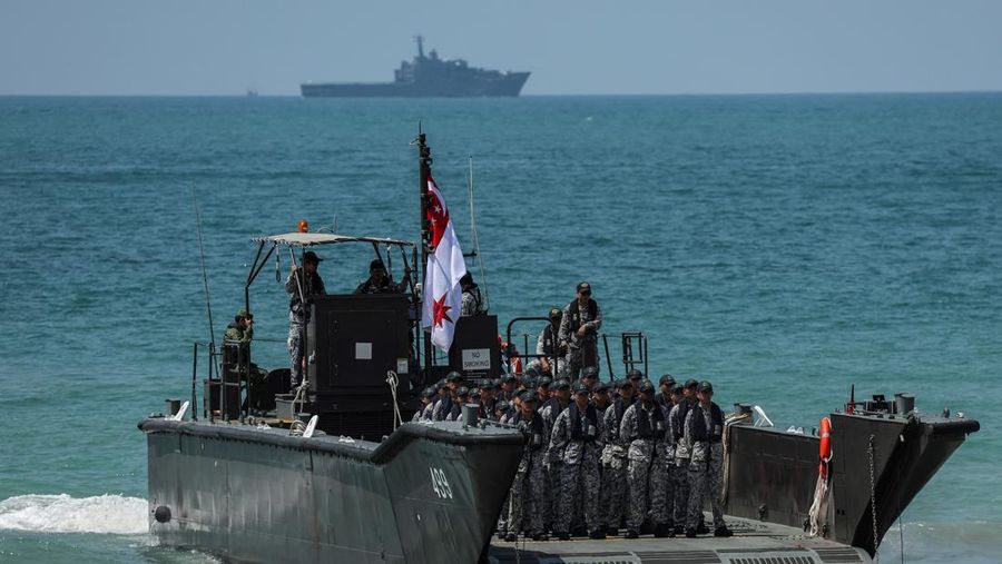 Smoke rises from an amphibious assault vehicles (AAV) participating in an amphibious assault exercise as part of the 