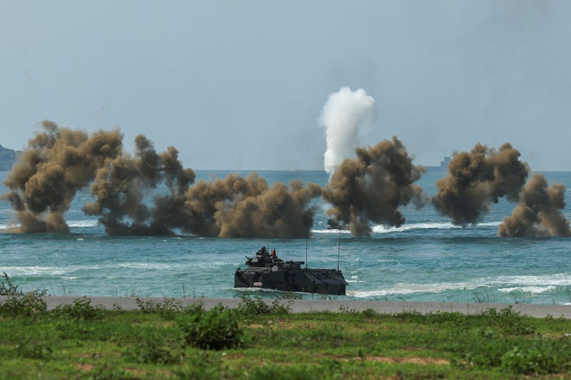 THAILAND-USA/MILITARY DRILL Smoke rises from an amphibious assault vehicles (AAV) participating in an amphibious assault exercise as part of the
