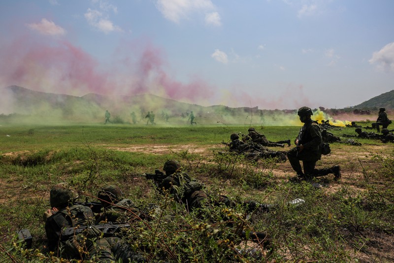 Smoke rises from an amphibious assault vehicles (AAV) participating in an amphibious assault exercise as part of the 