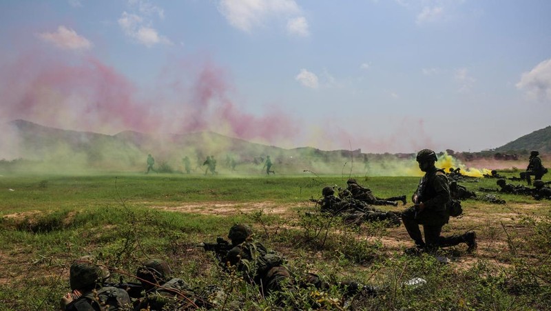 Smoke rises from an amphibious assault vehicles (AAV) participating in an amphibious assault exercise as part of the 