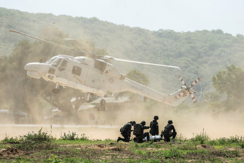 THAILAND-USA/MILITARY DRILL Smoke rises from an amphibious assault vehicles (AAV) participating in an amphibious assault exercise as part of the