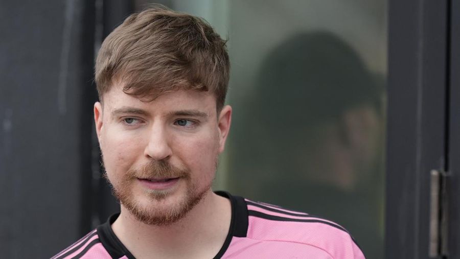 FILE - Jimmy Donaldson, the popular YouTube video maker who goes by MrBeast, wears a Lionel Messi jersey as he stands in a sideline box at the start of an MLS soccer match between Inter Miami and CF Montreal Sunday, March 10, 2024, in Fort Lauderdale, Fla. (AP Photo/Rebecca Blackwell, File)