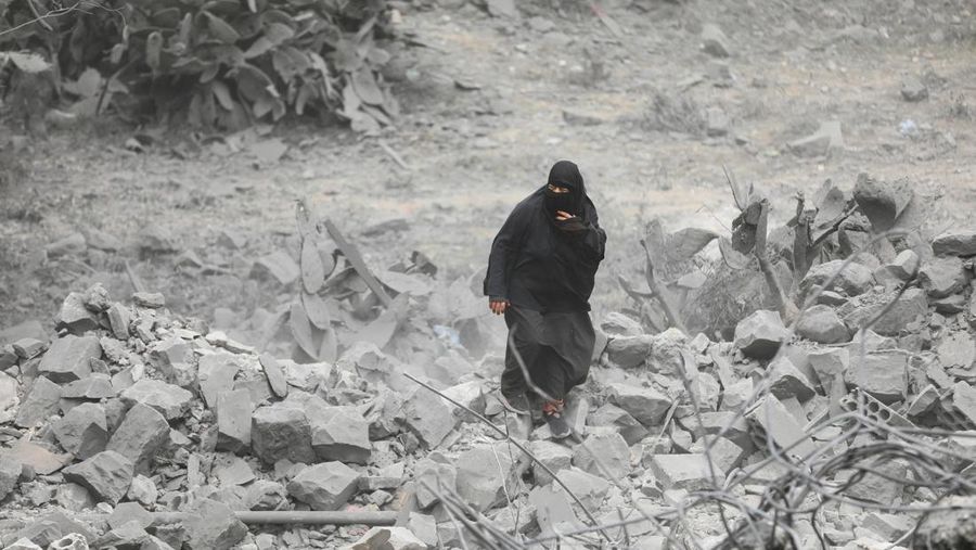 People look at the site of a U.S. strike in Sanaa, Yemen March 24, 2025. REUTERS/Khaled Abdullah