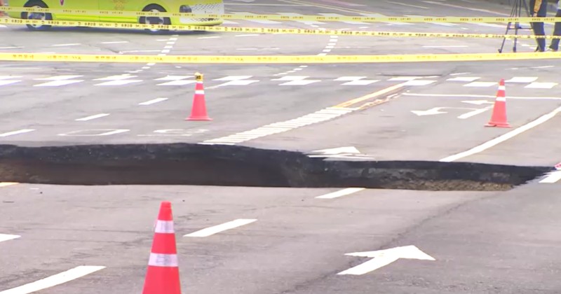Emergency workers stand near a sinkhole in a road, in Seoul, South Korea, March 25, 2025. Yonhap via REUTERS Emergency workers stand near a sinkhole in a road, in Seoul, South Korea, March 25, 2025. Yonhap via REUTERS