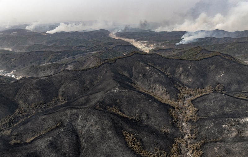 Houses burn in a village after being engulfed by a wildfire fueled by strong winds in Uiseong, South Korea, Monday, March 24, 2025. (Yoon Gwan-shick/Yonhap via AP)