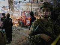 Civil defence and Lebanese army soldiers work at the site of an Israeli targeted strike on an apartment building in Dahiyeh, in the southern suburb of Beirut, Lebanon, early Tuesday, April 1, 2025.(AP Photo/Hussein Malla)