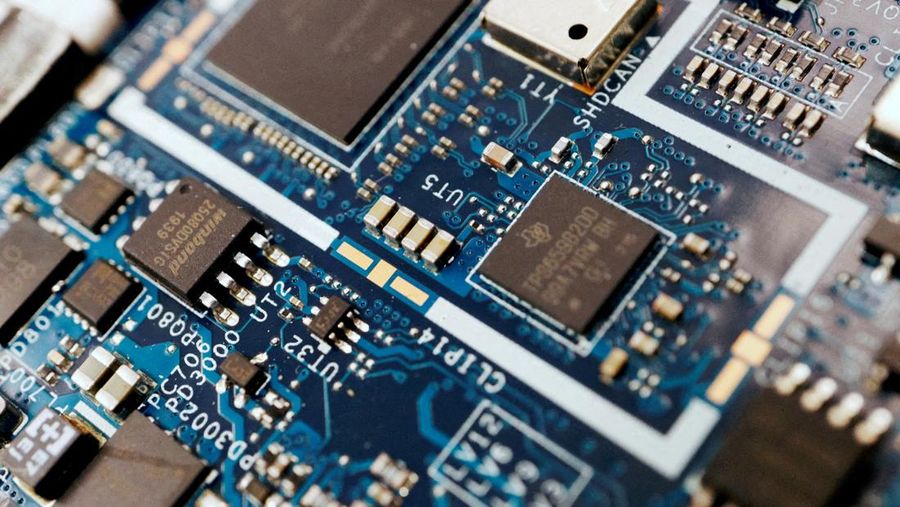 FILE PHOTO: Semiconductor chips are seen on a circuit board of a computer in this illustration picture taken February 25, 2022. REUTERS/Florence Lo/Illustration/File Photo