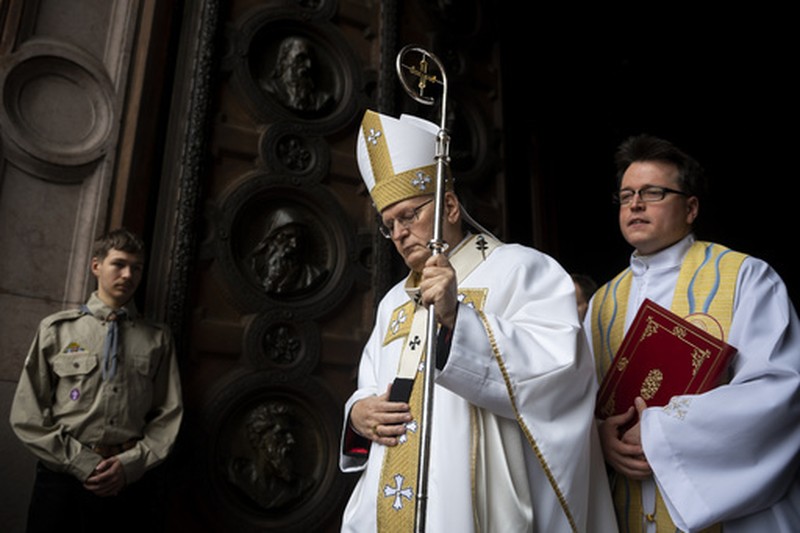 Catholic faithful sit in front an icon of the Virgin Mary at the Santa Maria Maggiore Basilica, Tuesday, Feb. 25, 2025. (AP Photo/Bernat Armangue)