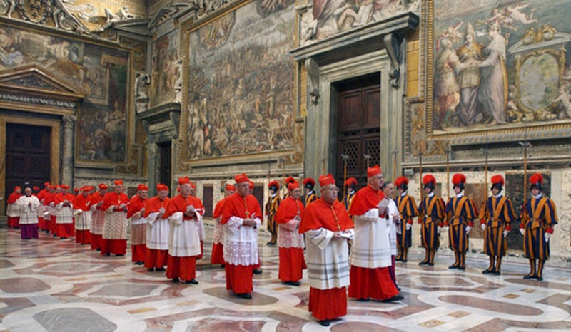 Catholic faithful sit in front an icon of the Virgin Mary at the Santa Maria Maggiore Basilica, Tuesday, Feb. 25, 2025. (AP Photo/Bernat Armangue)
