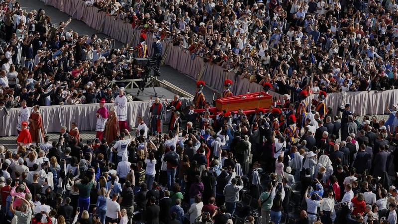 The body of Pope Francis lies inside St. Peter's Basilica at the Vatican, Wednesday, April 23, 2025, where he will lie in state for three days. (AP Photo/Andrew Medichini, Pool)