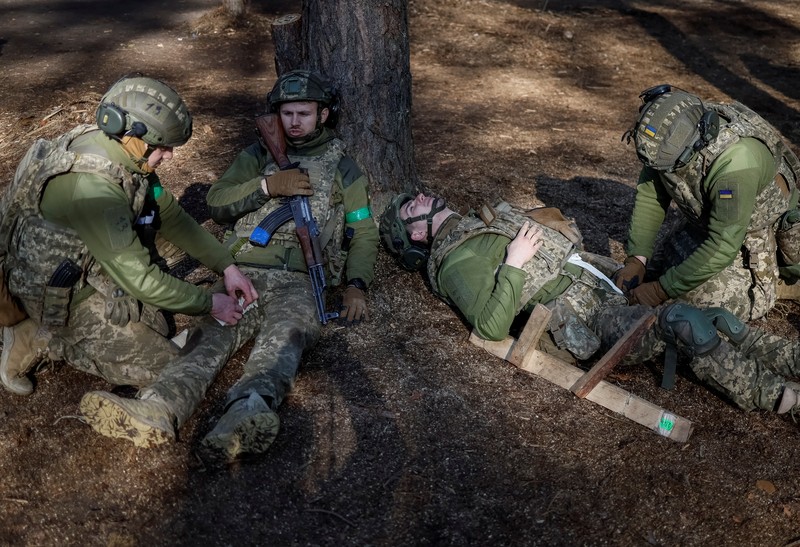 A combination picture shows young recruits of the 72nd Chorni Zaporozhtsi Separate Mechanized Brigade of the Ukrainian Armed Forces poses for a picture, amid Russia's attack on Ukraine, in Kyiv region, Ukraine April 5, 2025. Ukraine's Defence Ministry launched a recruitment drive for young people, 18- to 24-year-olds, to serve in the military for a year for the equivalent of about $24,000 and hefty bonuses. REUTERS/Gleb Garanich
