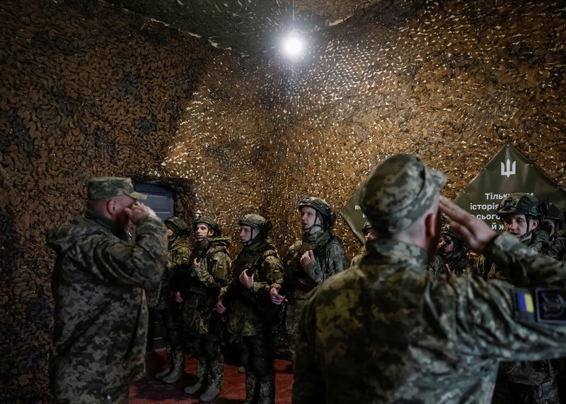 A combination picture shows young recruits of the 72nd Chorni Zaporozhtsi Separate Mechanized Brigade of the Ukrainian Armed Forces poses for a picture, amid Russia's attack on Ukraine, in Kyiv region, Ukraine April 5, 2025. Ukraine's Defence Ministry launched a recruitment drive for young people, 18- to 24-year-olds, to serve in the military for a year for the equivalent of about $24,000 and hefty bonuses. REUTERS/Gleb Garanich