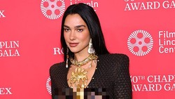 Gaya Seksi dan Berani Dua Lipa Berbalut Gaun Ular Transparan Schiaparelli