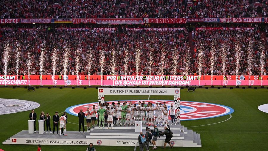 Soccer Football - Bundesliga - Bayern Munich v Borussia Moenchengladbach - Allianz Arena, Munich, Germany - May 10, 2025 General view of Bayern Munich players on the podium during the trophy ceremony after winning the Bundesliga REUTERS/Angelika Warmuth DFL REGULATIONS PROHIBIT ANY USE OF PHOTOGRAPHS AS IMAGE SEQUENCES AND/OR QUASI-VIDEO.