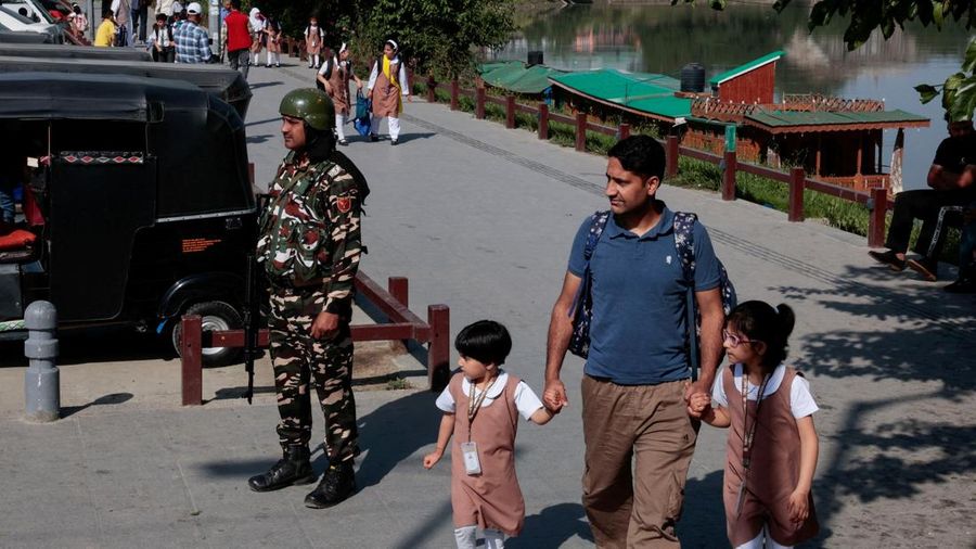 INDIA-PAKISTAN/ Students attend morning assembly as schools reopen following the ceasefire announcement between India and Pakistan, in Muzaffarabad, Pakistani Kashmir, May 13, 2025. REUTERS/Naseer ud Din