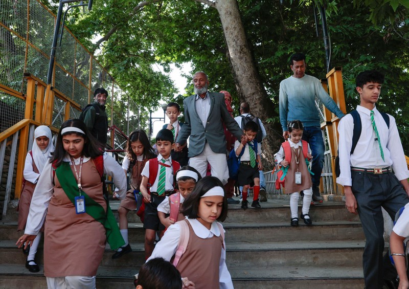 Students attend morning assembly as schools reopen following the ceasefire announcement between India and Pakistan, in Muzaffarabad, Pakistani Kashmir, May 13, 2025. REUTERS/Naseer ud Din