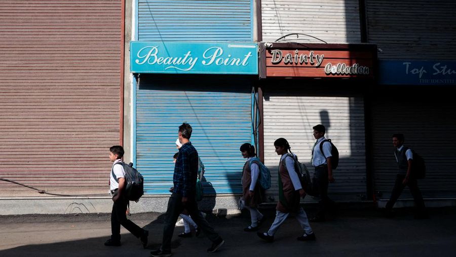 Students attend morning assembly as schools reopen following the ceasefire announcement between India and Pakistan, in Muzaffarabad, Pakistani Kashmir, May 13, 2025. REUTERS/Naseer ud Din