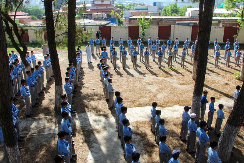 Students attend morning assembly as schools reopen following the ceasefire announcement between India and Pakistan, in Muzaffarabad, Pakistani Kashmir, May 13, 2025. REUTERS/Naseer ud Din