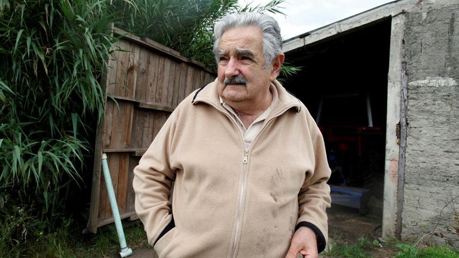 FILE PHOTO: Presidential candidate of ruling party Frente Amplio former left-wing guerrilla fighter Jose Mujica chats in his farm in the outskirts of Montevideo, Uruguau, November 27, 2009. REUTERS/Pablo La Rosa/File Photo