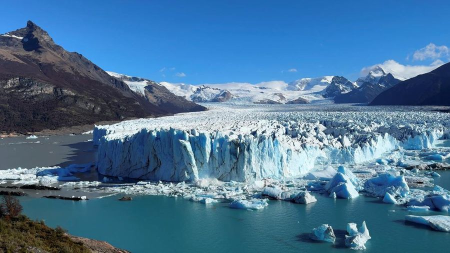 A combination of screengrabs from video shows ice calving off the Perito Moreno glacier into the Lago Argentino (Argentine Lake), in the Parque Nacional Los Glaciares, near the city of El Calafate in the Patagonian province of Santa Cruz, Argentina April 21, 2025. Reuters TV/via REUTERS