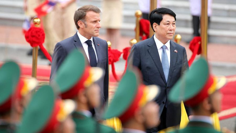 France's President Emmanuel Macron and Vietnam's President Luong Cuong shake hands during a meeting at the Presidential Palace in Hanoi on May 26, 2025.     NHAC NGUYEN/Pool via REUTERS