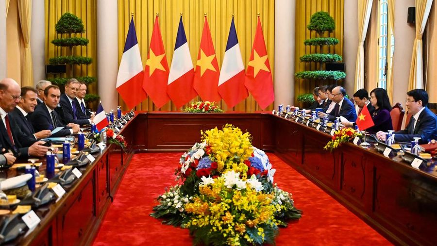 France's President Emmanuel Macron and Vietnam's President Luong Cuong shake hands during a meeting at the Presidential Palace in Hanoi on May 26, 2025.     NHAC NGUYEN/Pool via REUTERS