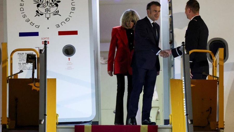 VIETNAM-FRANCE/MACRON-WIFE French President Emmanuel Macron stands near the door of a plane, as a hand appears and pushes his face away, in Hanoi, Vietnam, May 25, 2025, in this screengrab from a video. Reuters TV/via REUTERS