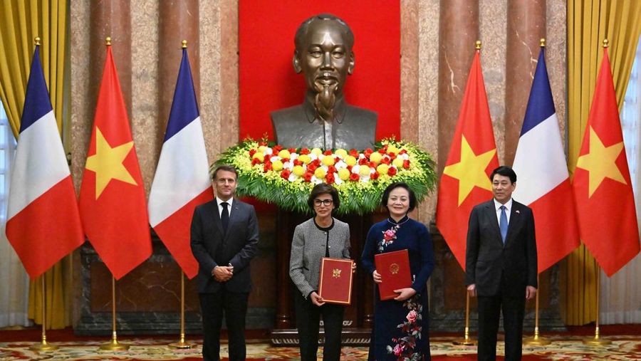 France's President Emmanuel Macron and Vietnam's President Luong Cuong shake hands during a meeting at the Presidential Palace in Hanoi on May 26, 2025.     NHAC NGUYEN/Pool via REUTERS