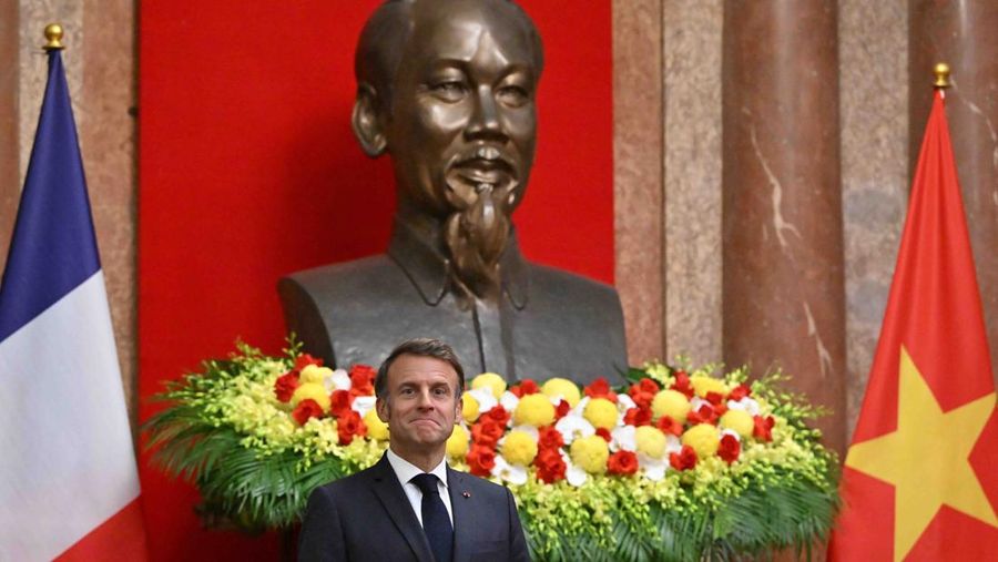 France's President Emmanuel Macron and Vietnam's President Luong Cuong shake hands during a meeting at the Presidential Palace in Hanoi on May 26, 2025.     NHAC NGUYEN/Pool via REUTERS