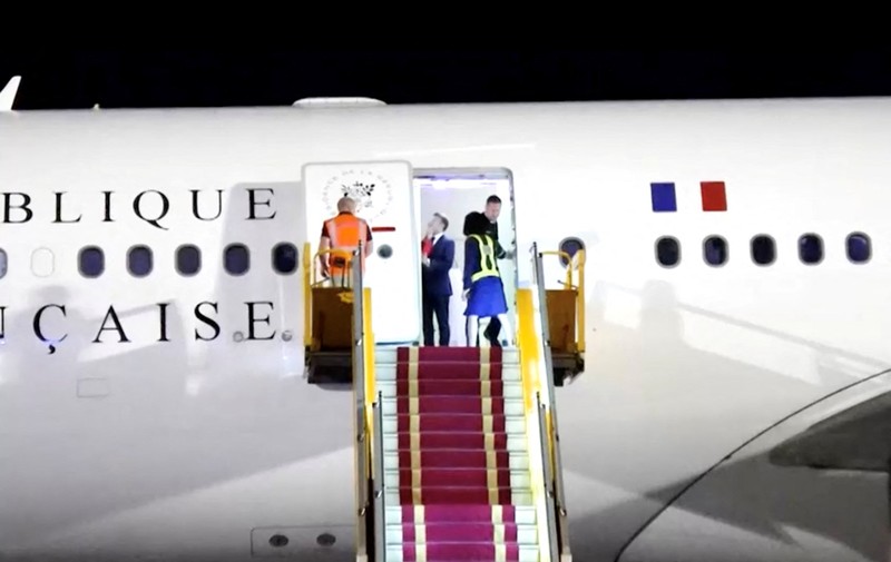 VIETNAM-FRANCE/MACRON-WIFE French President Emmanuel Macron stands near the door of a plane, as a hand appears and pushes his face away, in Hanoi, Vietnam, May 25, 2025, in this screengrab from a video. Reuters TV/via REUTERS