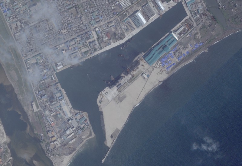 A satellite image shows a North Korean warship covered with a blue tarp after an accident that occurred during its launch at the shipyard, in Chongjin, North Korea, May 23, 2025. Maxar Technologies /Handout via REUTERS THIS IMAGE HAS BEEN SUPPLIED BY A THIRD PARTY. NO RESALES. NO ARCHIVES. MANDATORY CREDIT. MUST NOT OBSCURE LOGO.