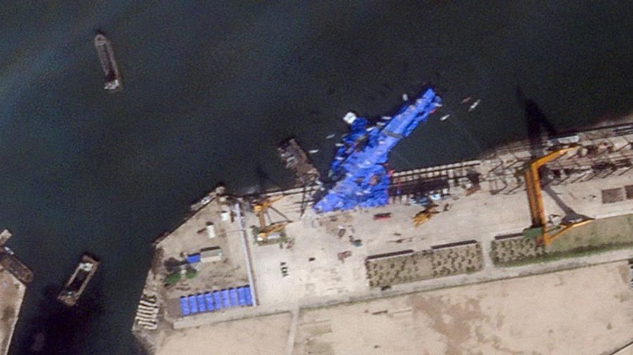 A satellite image shows a North Korean warship covered with a blue tarp after an accident that occurred during its launch at the shipyard, in Chongjin, North Korea, May 23, 2025. Maxar Technologies /Handout via REUTERS THIS IMAGE HAS BEEN SUPPLIED BY A THIRD PARTY. NO RESALES. NO ARCHIVES. MANDATORY CREDIT. MUST NOT OBSCURE LOGO.