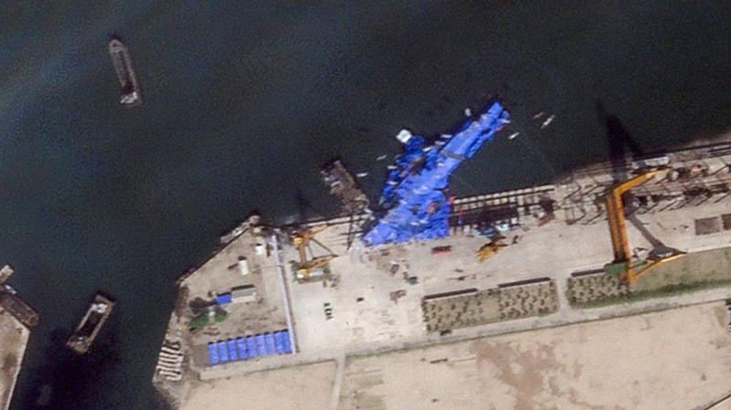 A satellite image shows a North Korean warship covered with a blue tarp after an accident that occurred during its launch at the shipyard, in Chongjin, North Korea, May 23, 2025. Maxar Technologies /Handout via REUTERS THIS IMAGE HAS BEEN SUPPLIED BY A THIRD PARTY. NO RESALES. NO ARCHIVES. MANDATORY CREDIT. MUST NOT OBSCURE LOGO.
