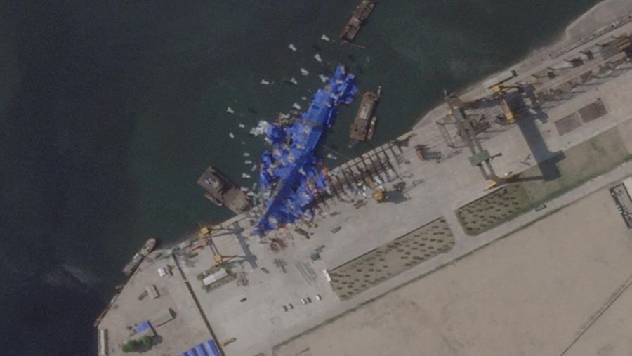NORTHKOREA-SHIP/ACCIDENT A satellite image shows a North Korean warship covered with a blue tarp after an accident that occurred during its launch at the shipyard, in Chongjin, North Korea, May 23, 2025. Maxar Technologies /Handout via REUTERS THIS IMAGE HAS BEEN SUPPLIED BY A THIRD PARTY. NO RESALES. NO ARCHIVES. MANDATORY CREDIT. MUST NOT OBSCURE LOGO.