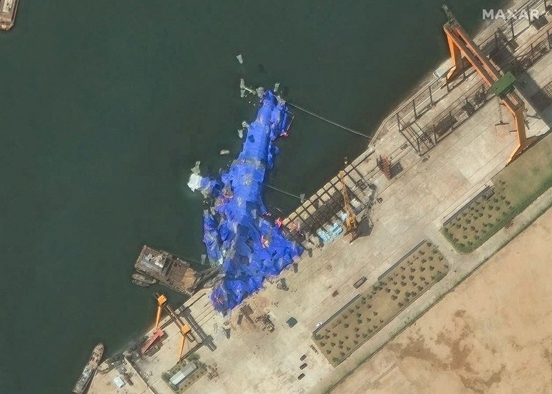 A satellite image shows a North Korean warship covered with a blue tarp after an accident that occurred during its launch at the shipyard, in Chongjin, North Korea, May 23, 2025. Maxar Technologies /Handout via REUTERS THIS IMAGE HAS BEEN SUPPLIED BY A THIRD PARTY. NO RESALES. NO ARCHIVES. MANDATORY CREDIT. MUST NOT OBSCURE LOGO.