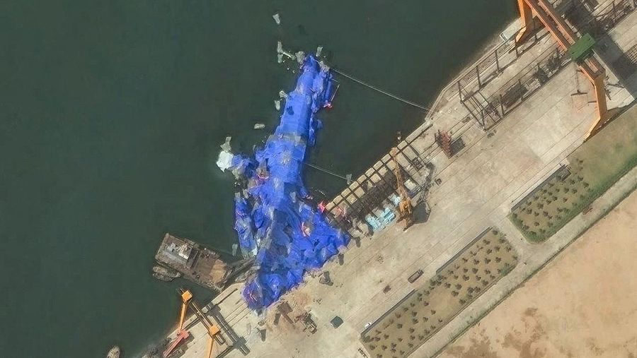 A satellite image shows a North Korean warship covered with a blue tarp after an accident that occurred during its launch at the shipyard, in Chongjin, North Korea, May 23, 2025. Maxar Technologies /Handout via REUTERS THIS IMAGE HAS BEEN SUPPLIED BY A THIRD PARTY. NO RESALES. NO ARCHIVES. MANDATORY CREDIT. MUST NOT OBSCURE LOGO.