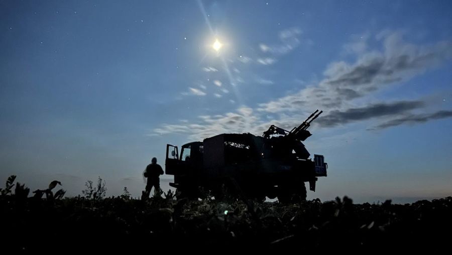 Servicemen from the mobile air defence unit of the 115th Separate Mechanized Brigade of the Ukrainian Armed Forces fire a ZU-23-2 anti-aircraft cannon towards a Russian drone during an overnight shift, amid Russia's attack on Ukraine, in Kharkiv Region, Ukraine June 2, 2025. REUTERS/Sofiia Gatilova
