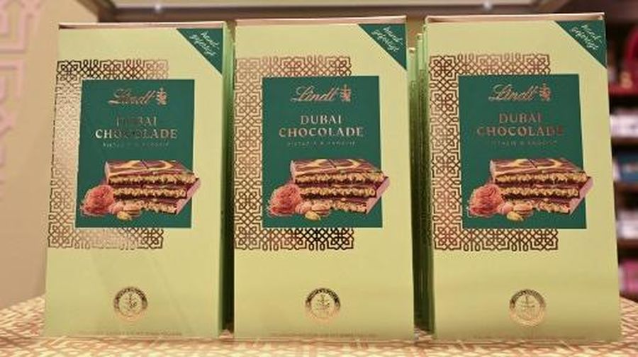 Dubai Chocolate bars stand in a branch of chocolate producer Lindt before the sale of 100 Dubai Chocolate bars starts in Stuttgart, southern Germany, on November 15, 2024. The hype around the chocolate bar - usually filled with pistachio and tahini p