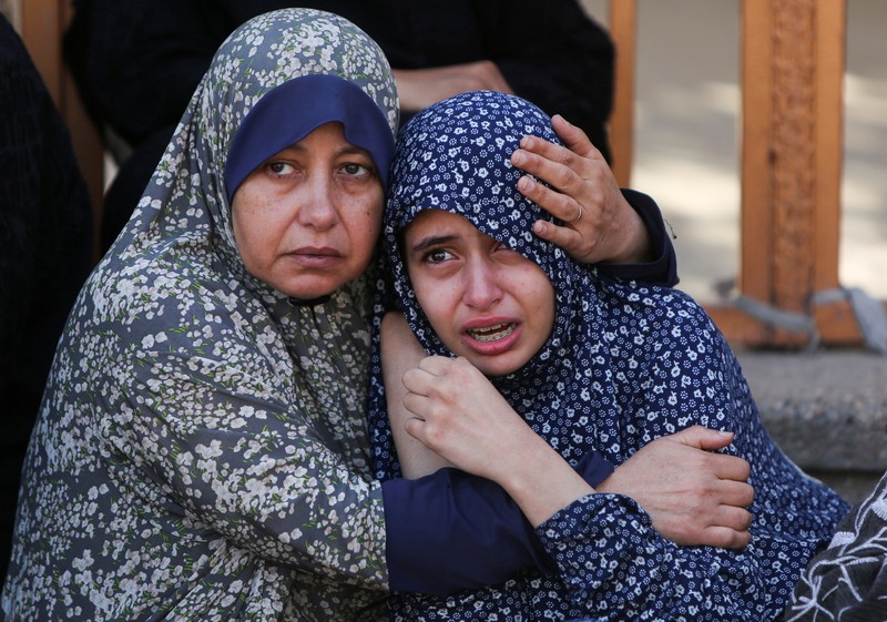 ISRAEL-PALESTINIANS/GAZA Mourners pray near the bodies of Palestinians killed, in what the Gaza health ministry say was Israeli fire near a distribution site in Rafah, at Nasser hospital in Khan Younis, in the southern Gaza Strip, June 3, 2025. REUTERS/Hatem Khaled