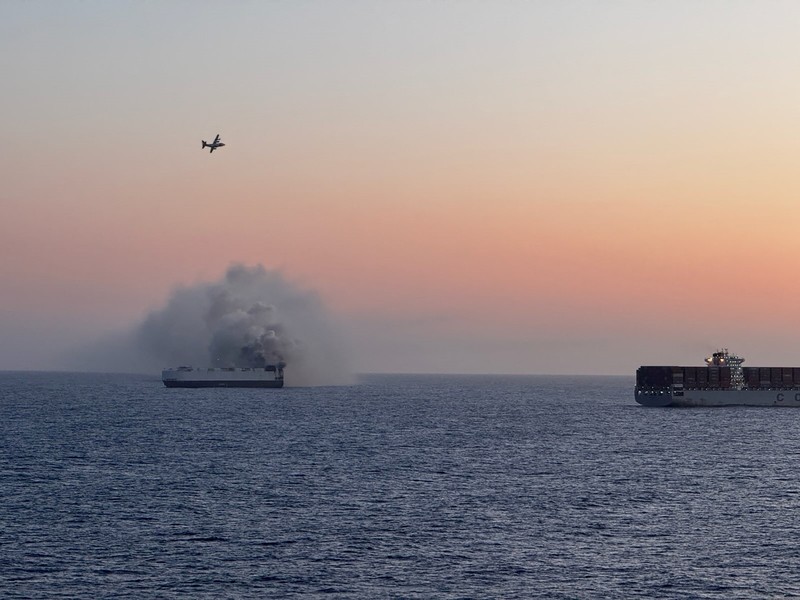 Smoke rises from a fire aboard the cargo vessel Morning Midas, carrying around 3,000 vehicles, including 800 electric vehicles, as seen in an aerial photograph taken from a U.S. Coast Guard C-130J Super Hercules, approximately 300 miles south of Adak, Alaska, U.S. June 3, 2025.  U.S. Coast Guard/Air Station Kodiak/Handout via REUTERS.  THIS IMAGE HAS BEEN SUPPLIED BY A THIRD PARTY