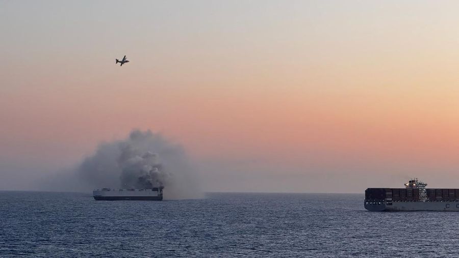 Smoke rises from a fire aboard the cargo vessel Morning Midas, carrying around 3,000 vehicles, including 800 electric vehicles, as seen in an aerial photograph taken from a U.S. Coast Guard C-130J Super Hercules, approximately 300 miles south of Adak, Alaska, U.S. June 3, 2025.  U.S. Coast Guard/Air Station Kodiak/Handout via REUTERS.  THIS IMAGE HAS BEEN SUPPLIED BY A THIRD PARTY